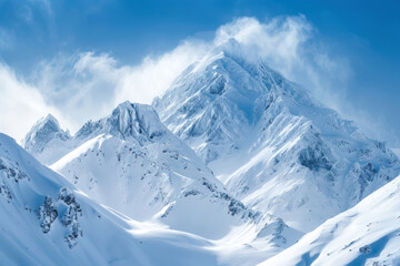 Obraz premium Snow-Covered Mountain Peak Under Clear Blue Sky