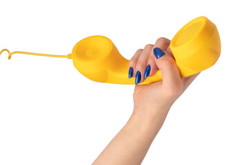 Yellow handset in woman hand isolated on white. Copy space.