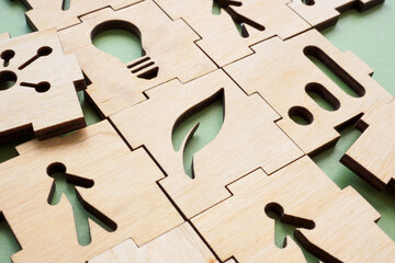 Sustainable marketing concept. Business puzzle pieces and plant leaf.