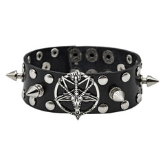 Black leather bracelet with pentagram, spikes, holnitenes. An accessory for rockers, bikers, metalheads, goths and punks. Steampunk style. Close-up subject photography.