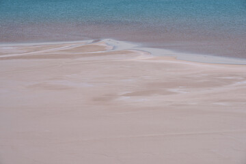 Delicate light sand and azure water.