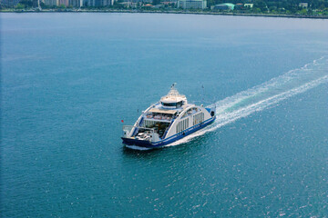 Passenger ferry boat for transportation cars cruising in sea. Sea logistics and transportation