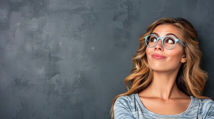 A young woman with long, blonde curls, wearing blue-rimmed glasses, looks pensively to the side. Her expression suggests she is deep in thought, contemplating a question or pondering a solution