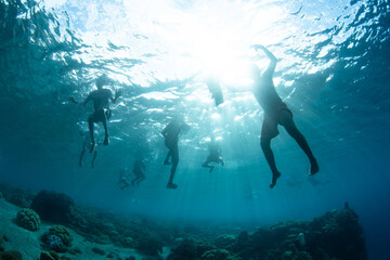 Children from a local village swim in the shallows above a coral reef in the Pantar Strait, Indonesia. This body of water, between Pantar and Alor, harbors extraordinary marine biodiversity. © ead72