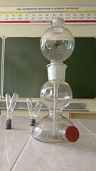 Chemical glassware in a chemistry lesson. Demonstration experience.