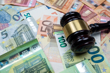 Judge hammer above  euro banknotes money. Bribe concept