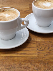 Coffee in white cups. Two white cups with coffee