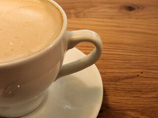 Cup of coffee on the table. Brewed coffee in a cup