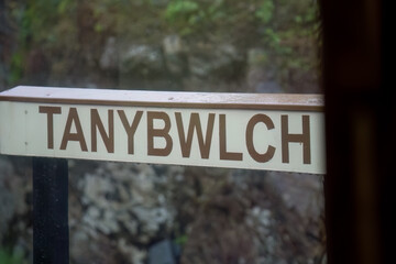 Fototapeta premium close-up of painted sign posts on a steam railway, the Ffestiniog Railway, Porthmadog, Wales