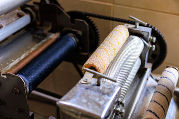 Machine for the production of raw materials from natural beeswax for candle products. Family farming business