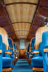 beautiful interior of a steam train passenger carriage, a vintage working steam locomotive train of the Ffestiniog Railway, Porthmadog, Wales