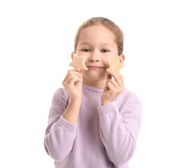 Cute little girl with tasty cookies on white background