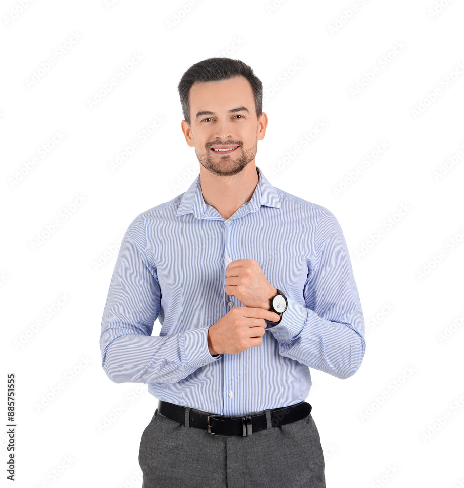 Wall mural Handsome businessman with wristwatch on white background