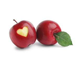 Fresh red apple with carved heart on white background