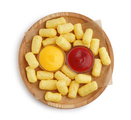 Wooden plate with tasty corn sticks and sauces on white background