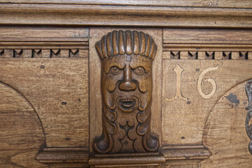 Decorative carved wood element on antique furniture. Decoration on furniture. Wood carving, decoration, adornment, decorating