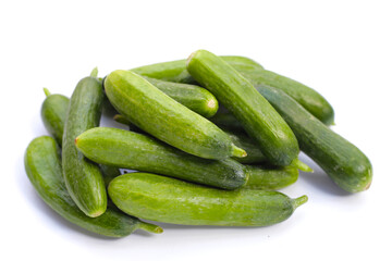Mini cucumbers on white background.