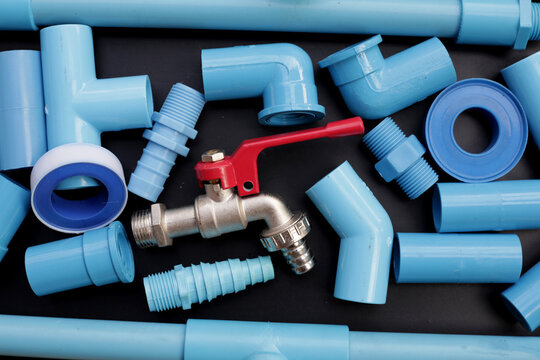 Plumber equipment with blue pvc pipe connections for plumbing work.