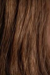 Naklejka premium A close-up shot of a woman's face with brown hair, looking directly at the camera
