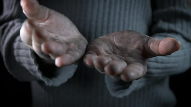 Female with empty hands at hungry time. A beggar female with empty hands suffer from crisis.