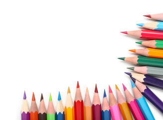 Frame made of color pencils on white background, closeup