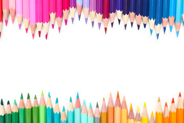 Frame made of color pencils on white background, closeup