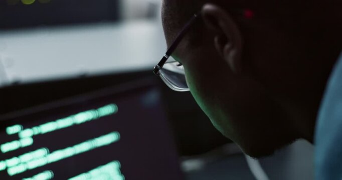 Black man, glasses and computer with coding in office for cybersecurity, software update or development. Programmer, pc and testing at workplace for information technology, data and surveillance