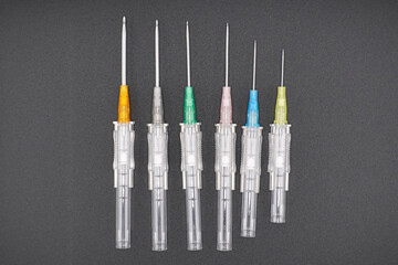 This is a group of intravenous catheters, laid into different patterns, creating a colorful background. This shows the health and medicine concept.