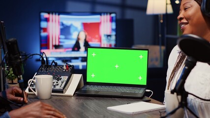 Isolated screen laptop next to analog mixer used by show host recording podcast in studio. Chroma key notebook near man professional audio device in live broadcast ensuring flawless sound quality