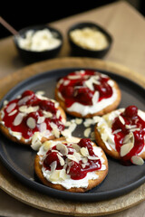Open sweet sandwiches with cherries