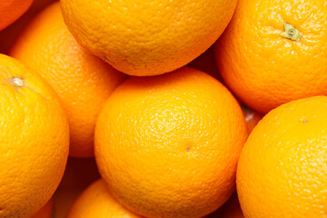 Fresh oranges as background, closeup