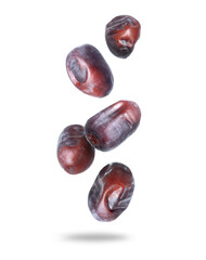 Big tasty dates in the air closeup isolated on a white background