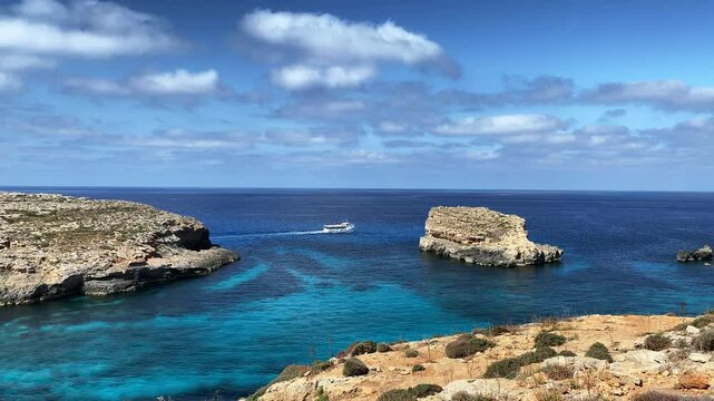 Comino Island Malta, Boat rides and visits to Comino Caves. Blue mediterranean sea. High quality 4k footage
