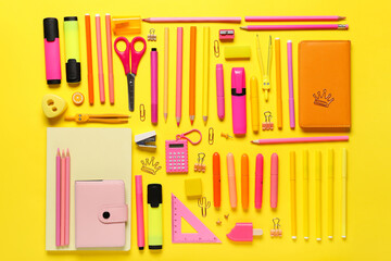 School supplies on yellow background. Top view