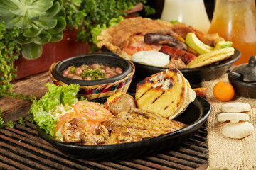 typical colombian food with barrel-roasted meat