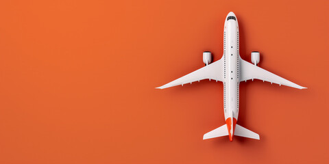 White and orange toy airplane model on an orange background