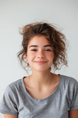 Fototapeta premium Unkempt woman wearing a gray shirt, perfect for editorial or lifestyle photography