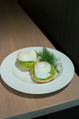 Eggs Benedict and poached eggs on avocado toast. Great for brunch fans and food lovers who want tasty and pretty dishes