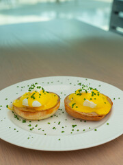 Eggs Benedict and poached eggs on avocado toast. Great for brunch fans and food lovers who want tasty and pretty dishes