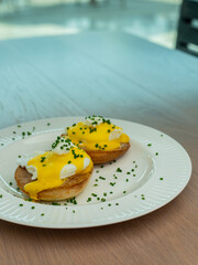 Eggs Benedict and poached eggs on avocado toast. Great for brunch fans and food lovers who want tasty and pretty dishes