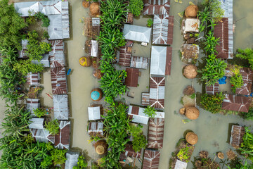 Aerial view showcasing the devastating impact of floods on villages in Northern Bangladesh, highlighting the submerged homes, affected communities, highlighting the severe impact and the resilience