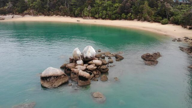 aerial panorama of split apple beach (towers bay) - famous bay with unique geological formation near abel tasman national park, new zealand south island