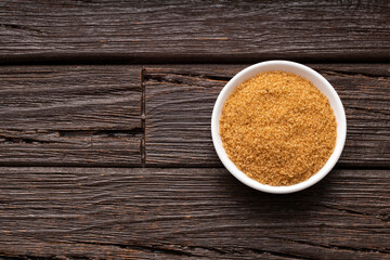 Organic cane panela powder in the bowl - Saccharum officinarum