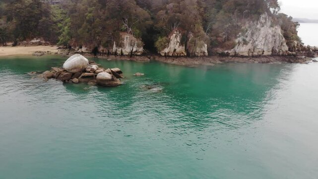 aerial panorama of split apple beach (towers bay) - famous bay with unique geological formation near abel tasman national park, new zealand south island