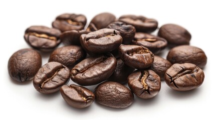 Fototapeta premium A close-up shot of a pile of coffee beans on a white surface