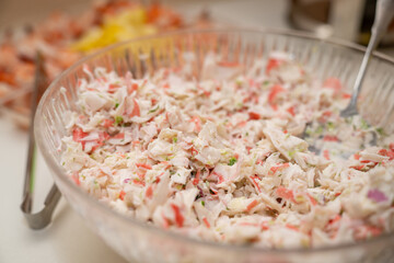 Imitation crab salad, salad with crab sticks in a bowl. © Tanya