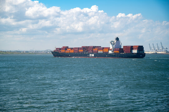 New York, NY, USA 07-10-2024 ZIM cargo ship stacked with colorful shipping containers in NYC harbor