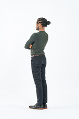 Full-body photo of a black man standing with his arms folded rear view