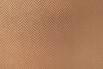 Close-up texture of a material with a repetitive diamond-shaped pattern. 