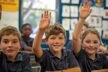 Three primary school students in the classroom with raised hands, eagerly waiting to answer the teacher’s questions, showcasing an engaged learning environment and enthusiasm for education.